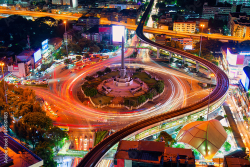 Thailand victory monument and main traffic for road in Bangkok, Thailand.Bangkok city night view with main traffic high way.