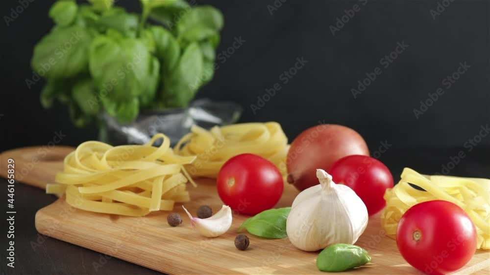 pasta raw ingredients on wooden table panning shot close view pasta raw ingredients on wooden table panning shot close view