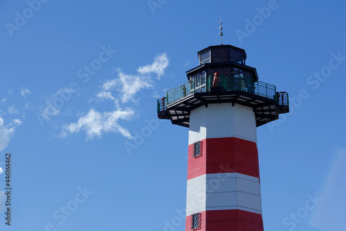 Image of red lighthouse crest with white and space for text. Boquete Tourist Viewpoint - Panama
