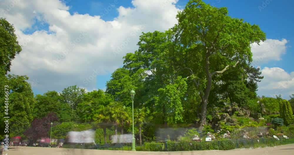 Timelapse of Parc Monceau with people, green trees and cloudy blue sky - 4k Timelapse of Parc Monceau with people, green trees and cloudy blue sky - 4k