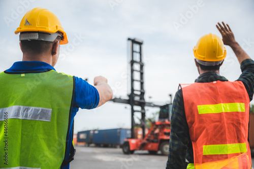 worker teamwork and partner of foreman, engineer, and businessman working in an international shipping area, concept of business industrial and working in container yard.