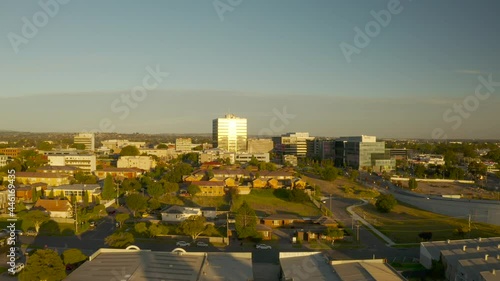Slow aerial approach to Dandenong City Center, Victoria, Australia. photo