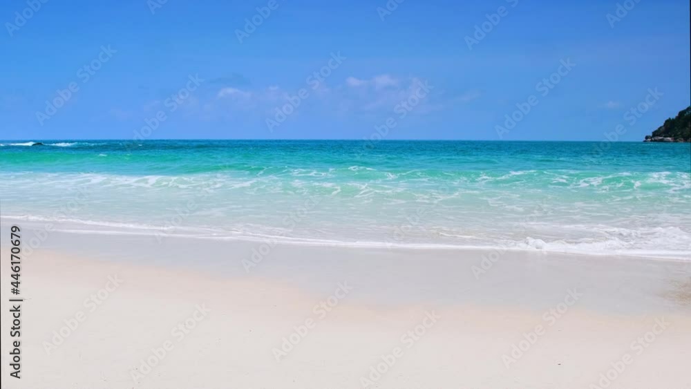 4K UHD Beautiful tropical beach with blue sky and clouds. Tropical beach with waves crashing empty beach. Andaman Phuket beach Thailand. 4K UHD Beautiful tropical beach with blue sky and clouds. Tropical beach with waves crashing empty beach. Andaman Phuket beach Thailand.