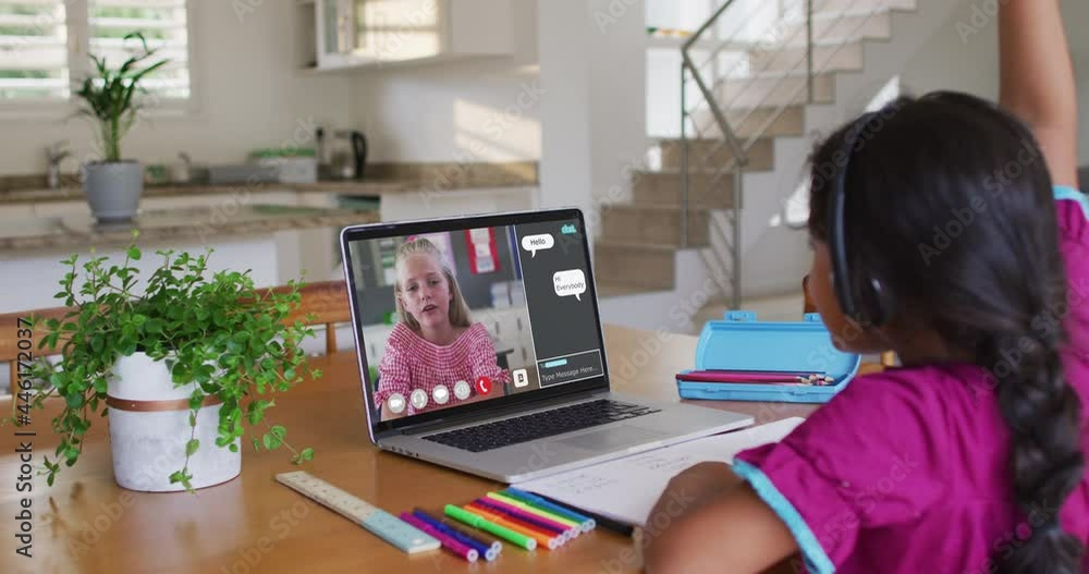Schoolgirl using laptop for online lesson at home, with her colleague and web chat on screen Schoolgirl using laptop for online lesson at home, with her colleague and web chat on screen