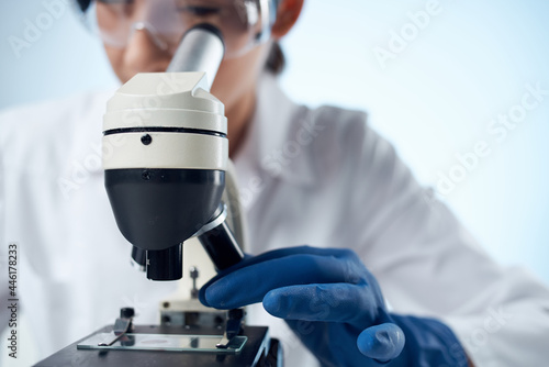 woman laboratory assistant research diagnostics microscope science close-up