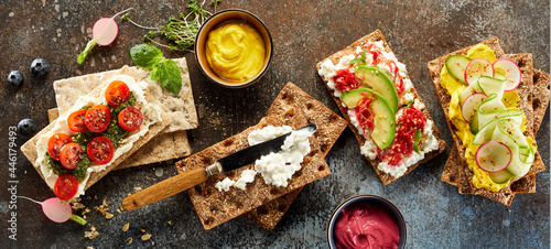 Fotografie Tasty crispbread toasts placed on table in studio