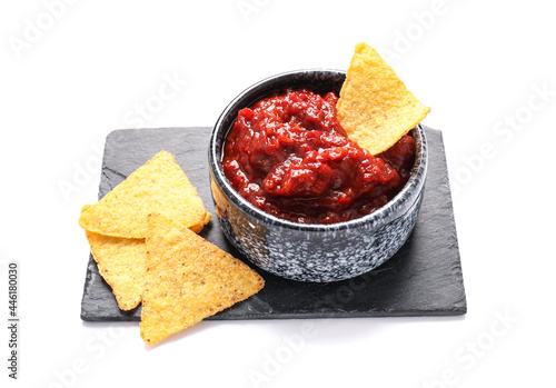 Canvastavla Bowl of chili sauce with nachos on white background