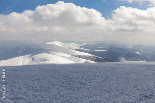 Winter Carpathian mountains. Borzhava mountain range. landscapes of winter mountains. Snow drifts are treated by the wind, against the background of winter mountains. © ihorhvozdetskiy