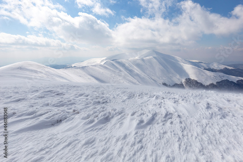 Winter Carpathian mountains. Borzhava mountain range. landscapes of winter mountains. Snow drifts are treated by the wind  against the background of winter mountains.