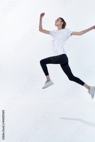 cheerful athletic woman jumping energy workout cardio