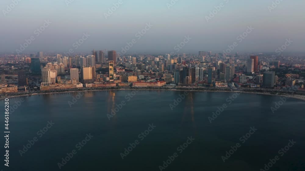 Traveling front, sky line Luanda city, golden hour flying over Luanda bay, Africa Traveling front, sky line Luanda city, golden hour flying over Luanda bay, Africa