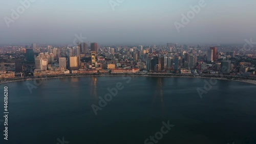 Wallpaper Mural Traveling front, sky line Luanda city, golden hour flying over Luanda bay, Africa Torontodigital.ca