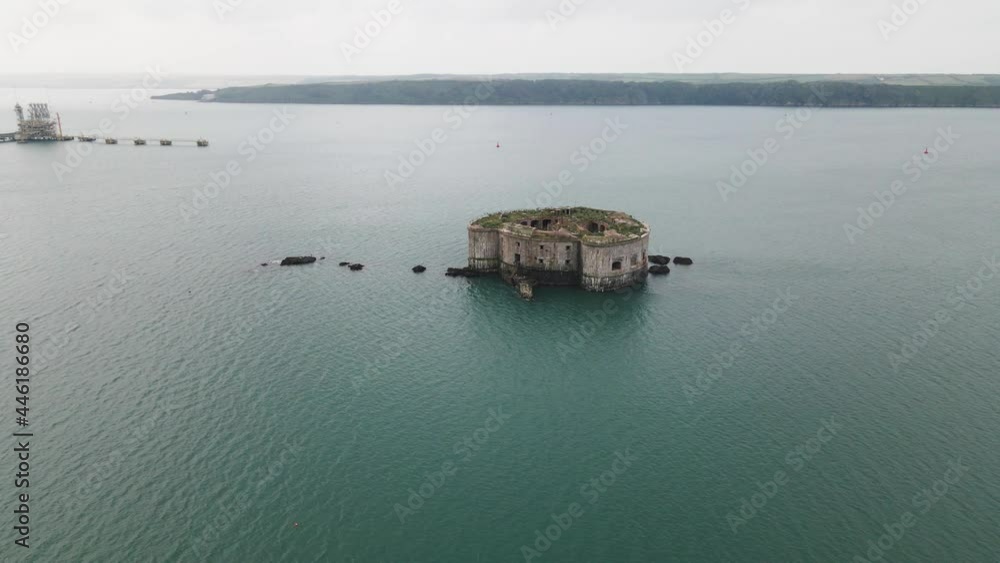 Calm Waters Of Milford Haven With Historic Building Of Stack Rock Fort In Wales. - aerial Calm Waters Of Milford Haven With Historic Building Of Stack Rock Fort In Wales. - aerial