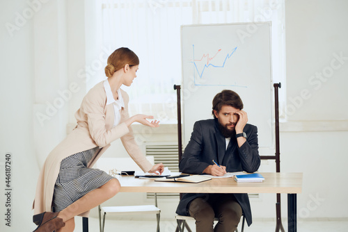 фотографія man and woman in the office at the desk, communication, work