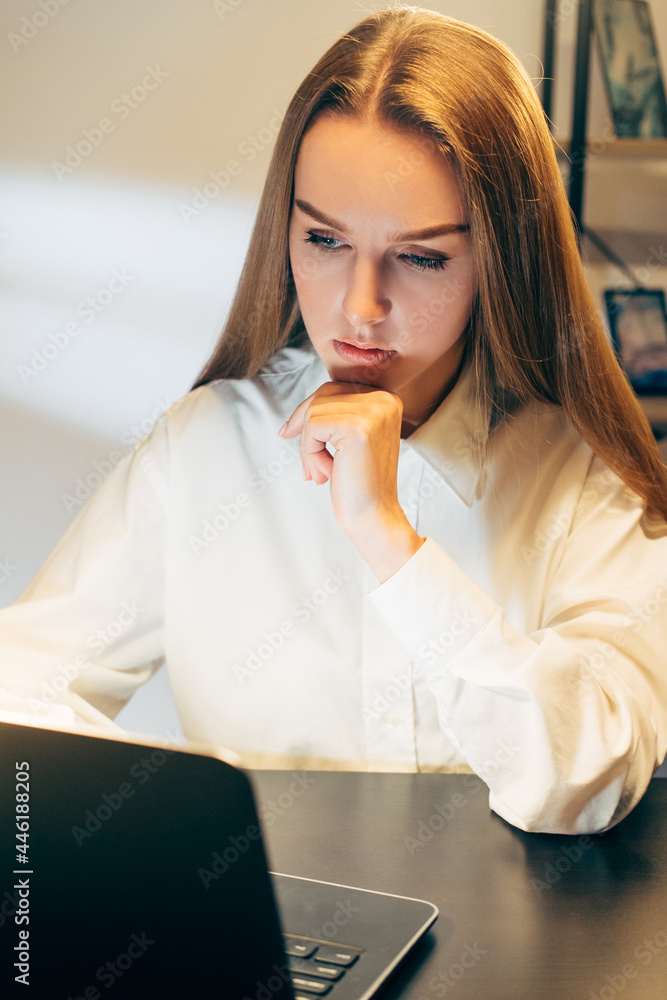 Overtime work. Remote job. Pandemic lockdown lifestyle. Tired annoyed woman closing laptop and lying to have a nap on the desk Overtime work. Remote job. Pandemic lockdown lifestyle. Tired annoyed woman closing laptop and lying to have a nap on the desk