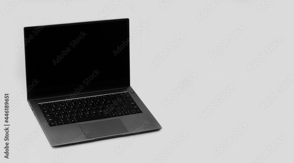 laptop on a grey background with a copy space laptop on a grey background with a copy space
