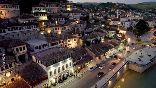 Night view of Berat, Albania. Flying over old houses, city with illumination. Berat is one of the most beautiful cities in Albania photo