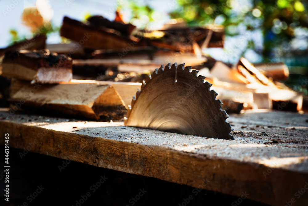 circular power saw. circular saw blade on a wooden machine. circular power saw. circular saw blade on a wooden machine.
