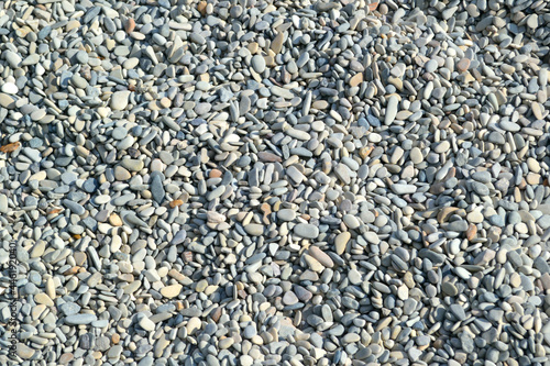 Marine pebble stones. Closeup. Background.  Sea beach. 