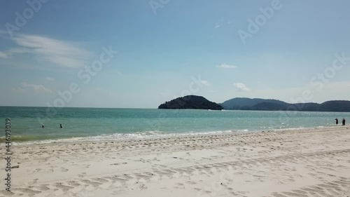 Sunny day on a white sand tropical beach on Langkawi Island, Southeast Asia