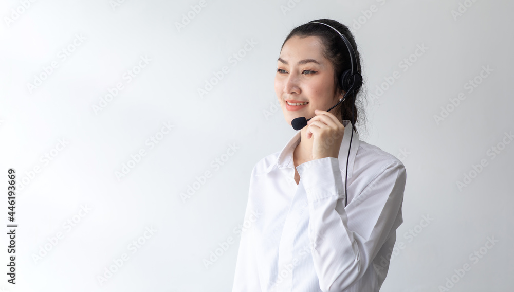 callcenter woman isolated on white background. Portrait Happy Asian woman operator and team working with headsets and desktop computer at telemarketing customer service. callcenter woman isolated on white background. Portrait Happy Asian woman operator and team working with headsets and desktop computer at telemarketing customer service.