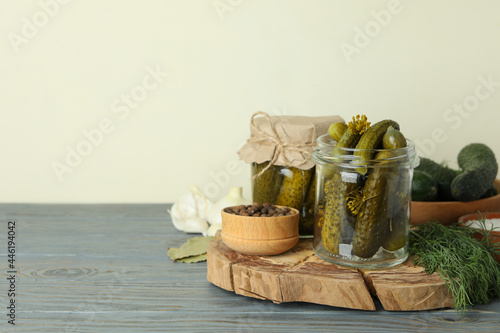 Concept of cooking pickles on gray wooden table