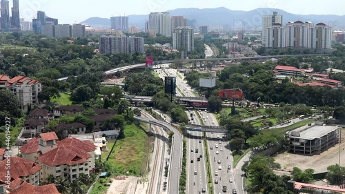 Kuala Lumpur, Malaysia - June 28 2019: Urban view of Kuala Lumpur on a sunny day. Buildings and skyscrapers seen in the distance