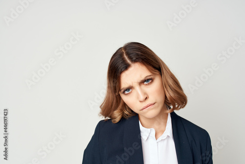 Business woman in suit fun emotions manager close-up light background