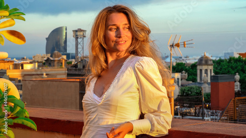 Caucasian woman posing with view of Barcelona on the background
