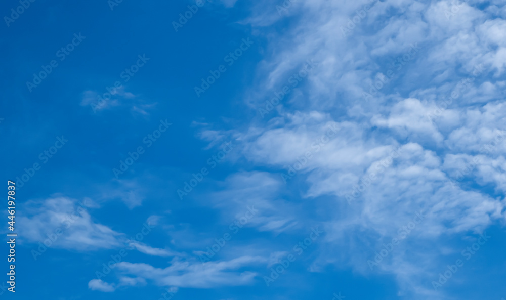Fototapeta premium Beautiful blue sky and white cirrocumulus clouds. Background. Scenery. Texture.