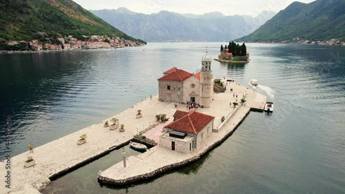 Flying around Our Lady of the Rocks island, Perast, Bay of Kotor, Montenegro. Aerial view of St. George and Gospa od Skrpela islands photo
