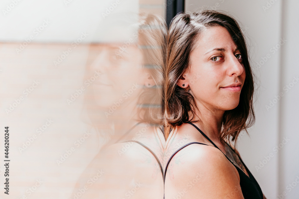 close up portrait of muscular caucasian woman at gym standing by window. Sport and healthy lifestyle close up portrait of muscular caucasian woman at gym standing by window. Sport and healthy lifestyle