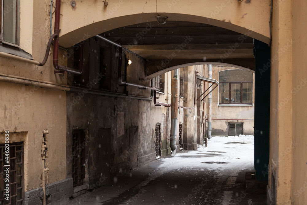 Arch inside courtyard of typical St Petersburg vintage apartment house