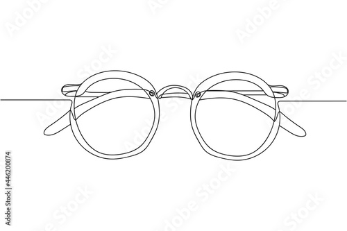 Continuous one line of sunglasses in silhouette on a white background. Linear stylized.