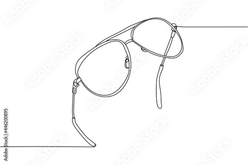 Continuous one line of sunglasses in silhouette on a white background. Linear stylized.Minimalist.
