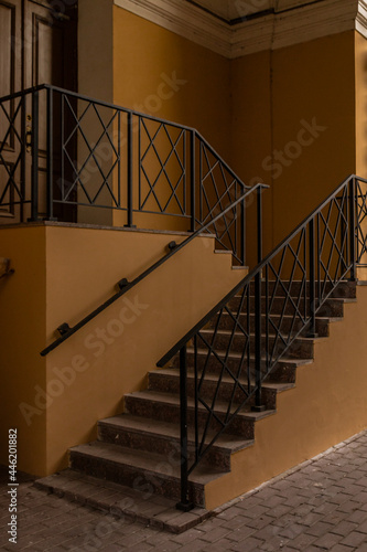 stairs with metal railings in the weak daylight