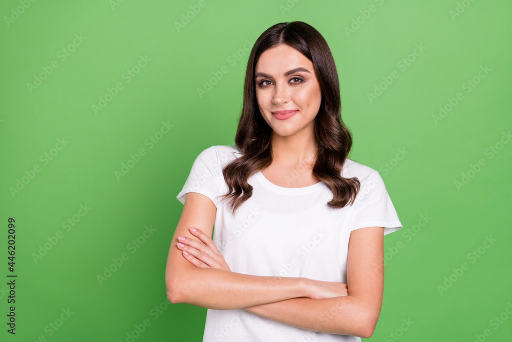 Photo of nice brunette millennial manager lady crossed arms wear t-shirt isolated on green color background Photo of nice brunette millennial manager lady crossed arms wear t-shirt isolated on green color background