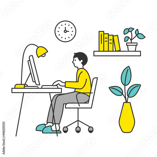 部屋でパソコンを使う男性