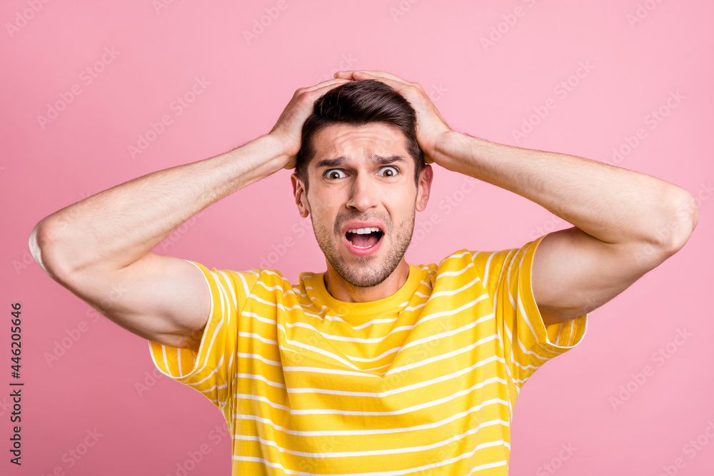 Portrait of attractive gloomy sullen worried guy bad news reaction mistake isolated over pink pastel color background Portrait of attractive gloomy sullen worried guy bad news reaction mistake isolated over pink pastel color background