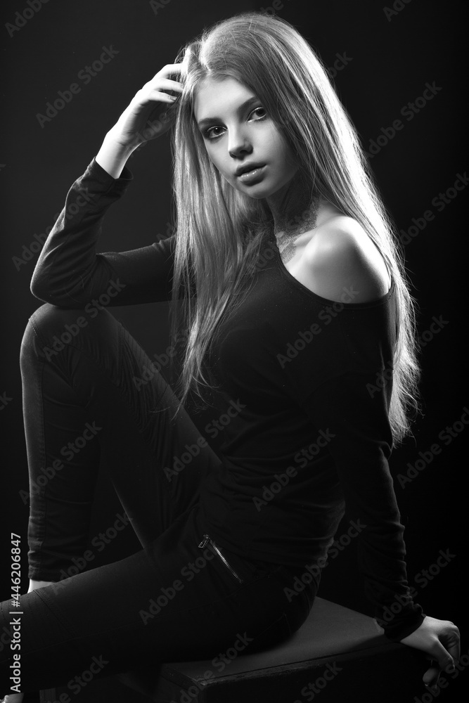 Black and white portrait of a confident woman with bare shoulders Black and white portrait of a confident woman with bare shoulders