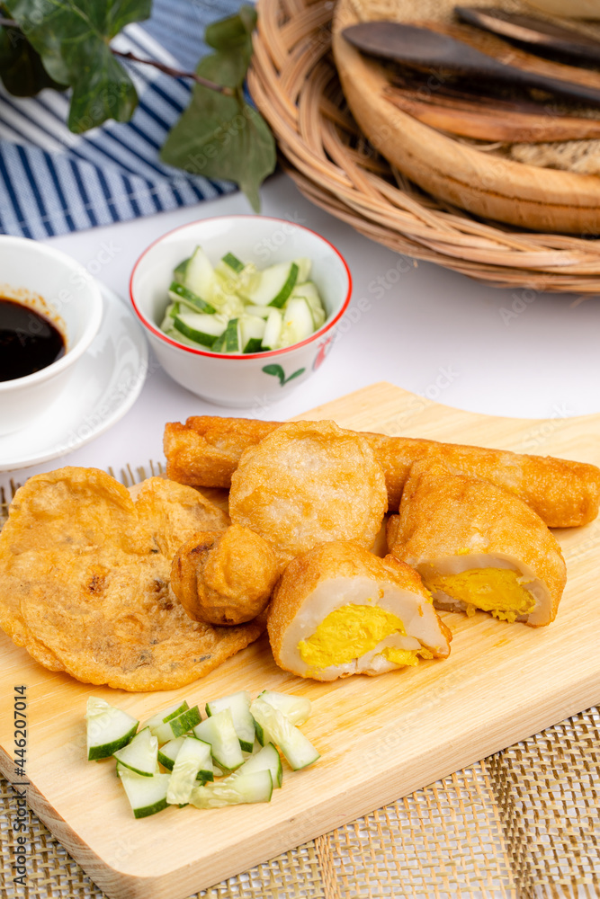 Pempek or empek-empek is a savoury Indonesian fishcake delicacy, made of fish and tapioca, from Palembang South Sumatera, Indonesia. Pempek is served with rich sweet and sour sauce called kuah cuko