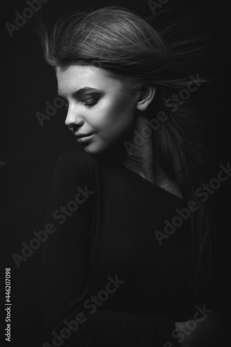 Black and white portrait of a glamor woman in the dark