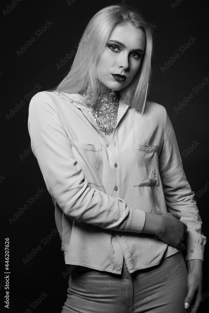Magnificent blond model posing with foil on her neck