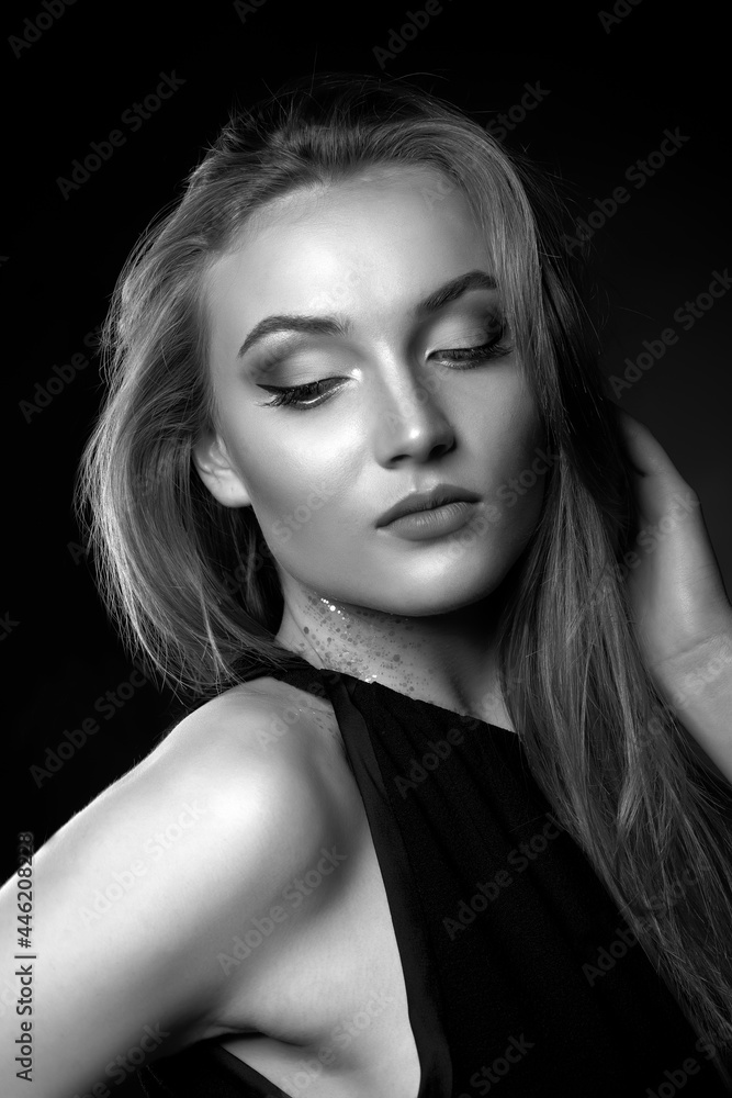 Fashionable lady with long straight hair wears classic black dress Fashionable lady with long straight hair wears classic black dress