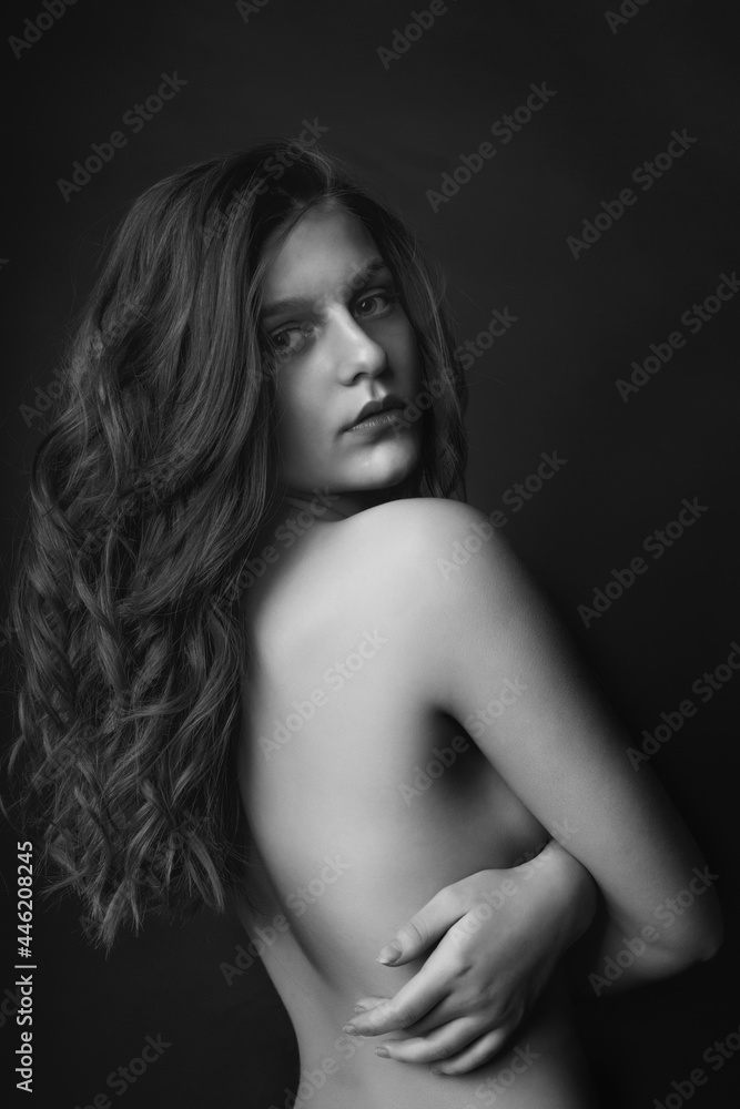 Seductive lady posing with bare shoulders at studio Seductive lady posing with bare shoulders at studio