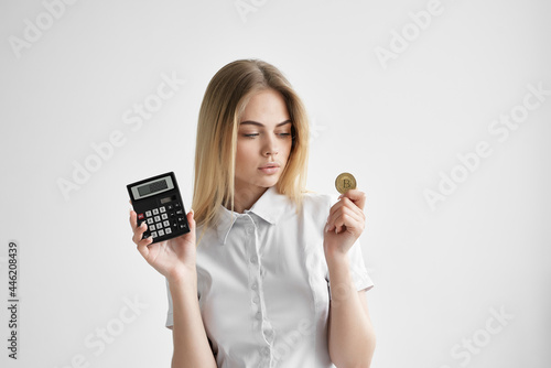 woman with calculator cryptocurrency bitcoin financial e-commerce