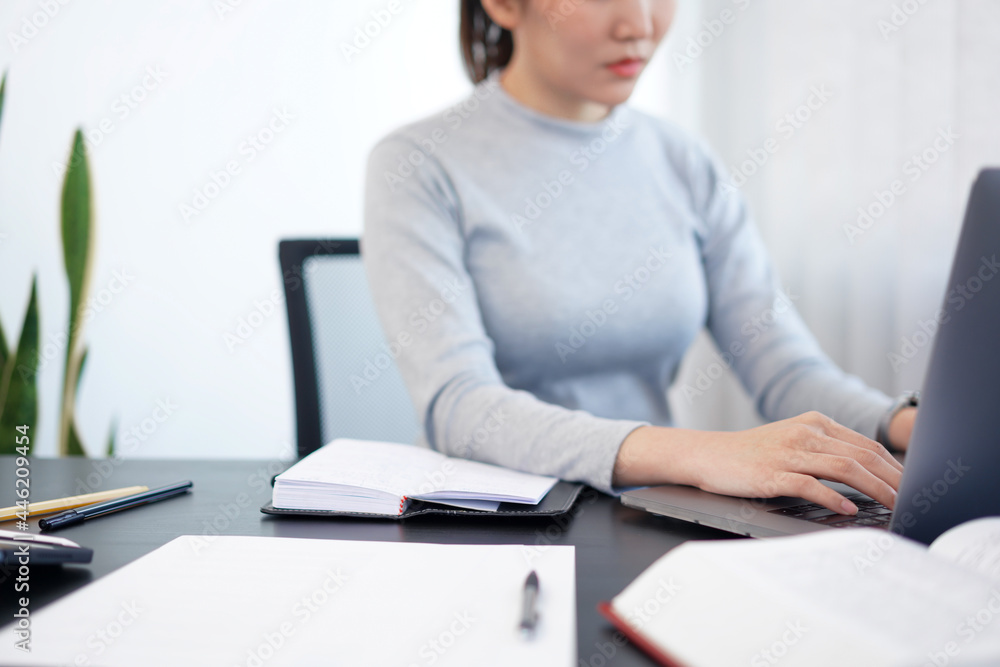 Office work concept a female secretary working on her duty about schedule arrangement and some important documents Office work concept a female secretary working on her duty about schedule arrangement and some important documents