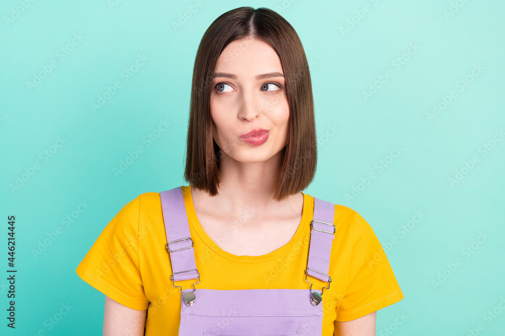 Photo of charming young dreamy thoughtful woman doubt look empty space isolated on teal color background Photo of charming young dreamy thoughtful woman doubt look empty space isolated on teal color background