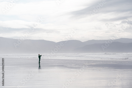 Man taking pictures on Beach in Dingle Peninsula, Ireland