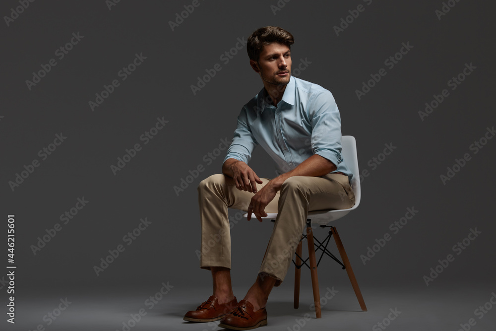 Focused european business man sitting on chair Focused european business man sitting on chair
